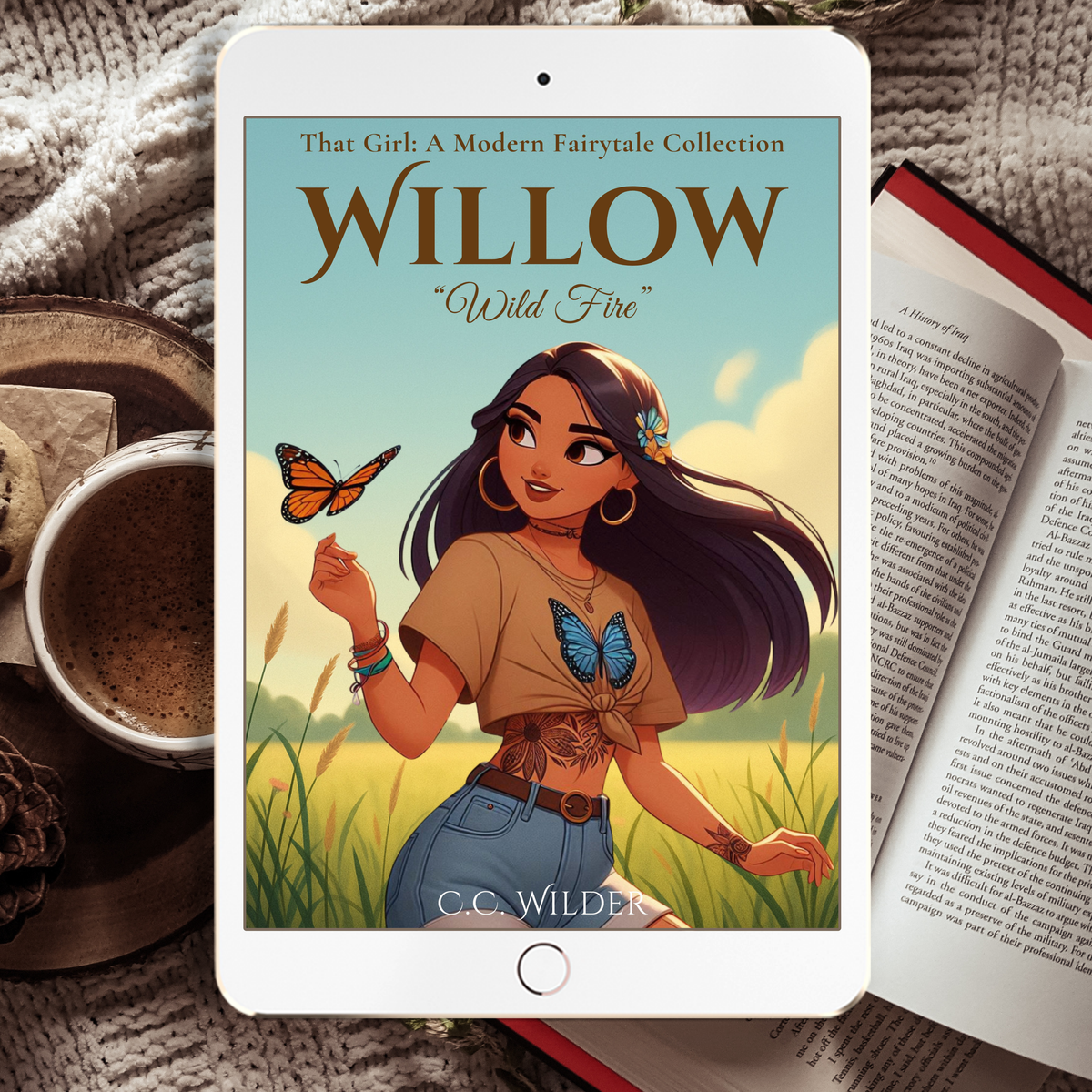 Book cover of 'Willow: Wild Fire' on a tablet with a cup and book in the background